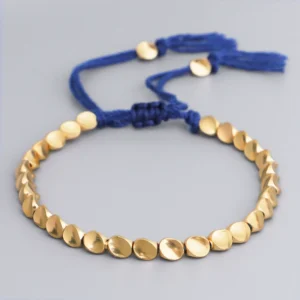 Heritage Tibetan Copper Bead Bracelet with red cord by Kris Nature