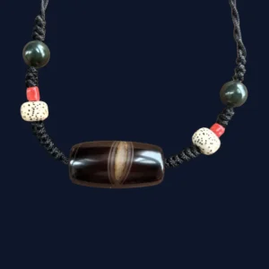 The Phoenix Eye Silk Agate Dzi necklace from Kris Nature