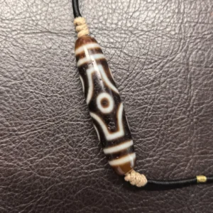 Hand-drawn Visvavajra Cross Vajra Six Eyes Dzi bead necklace on agate with artisan-treated patina and hand-textured weathered surface, adjustable hand-woven cord | Kris Nature